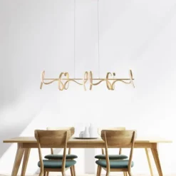 LED-Pendelleuchte in messing-matt mit 4 geschwungenen Leuchtarmen mit Dimmfunktion strahlt warmweiß
